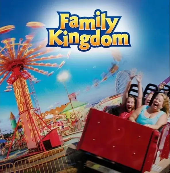 A family rides on the amusement park 's ferris wheel.