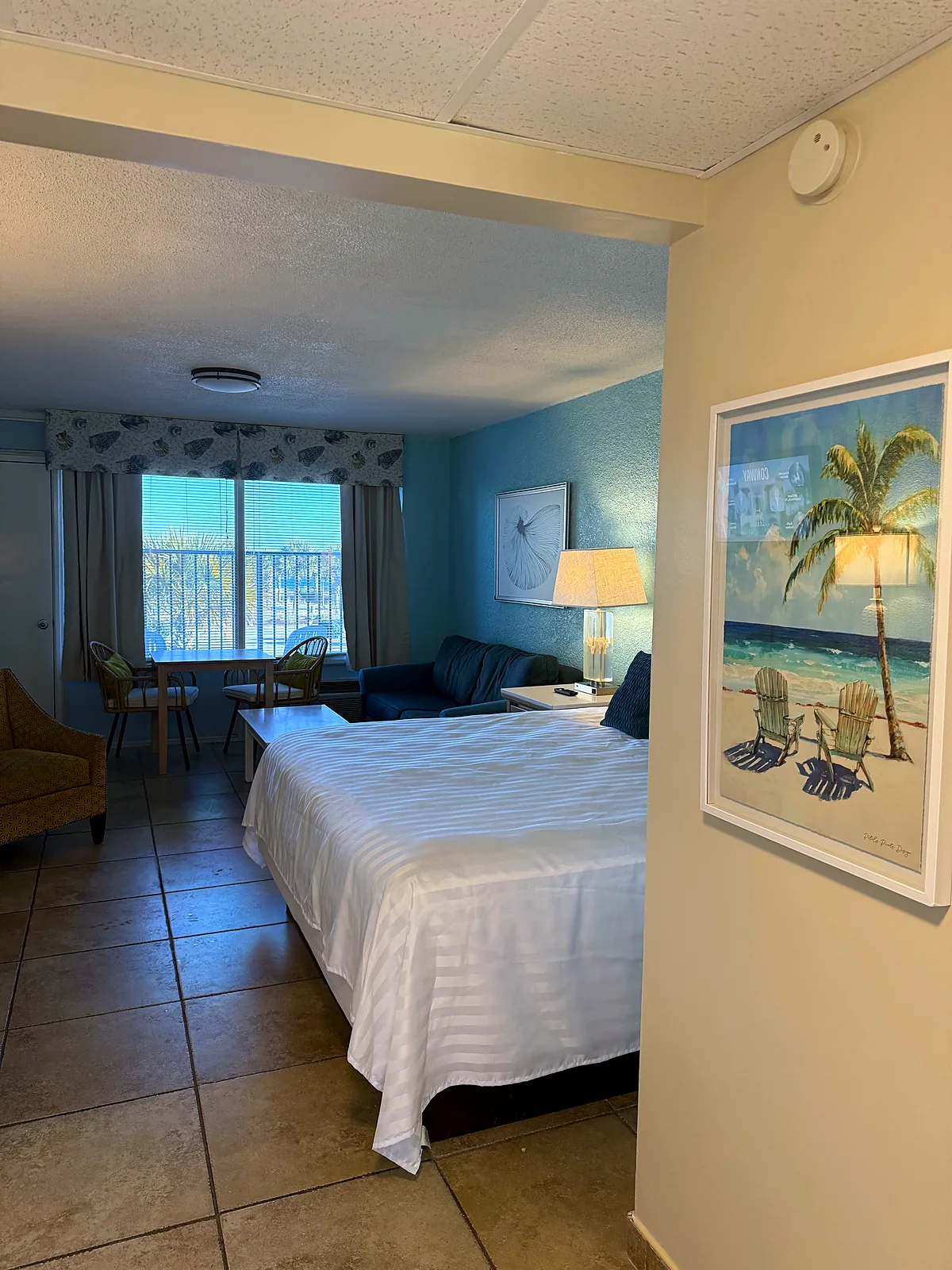 Bright king room with wide window and natural light