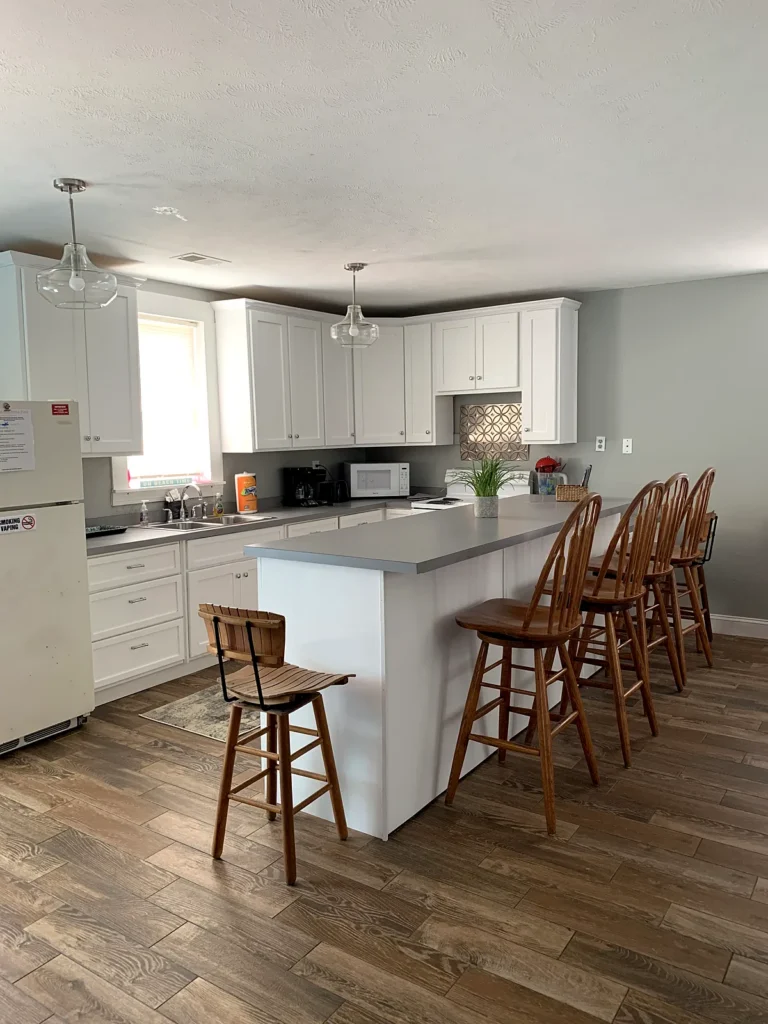 A Beach Place kitchen with breakfast bar and stools