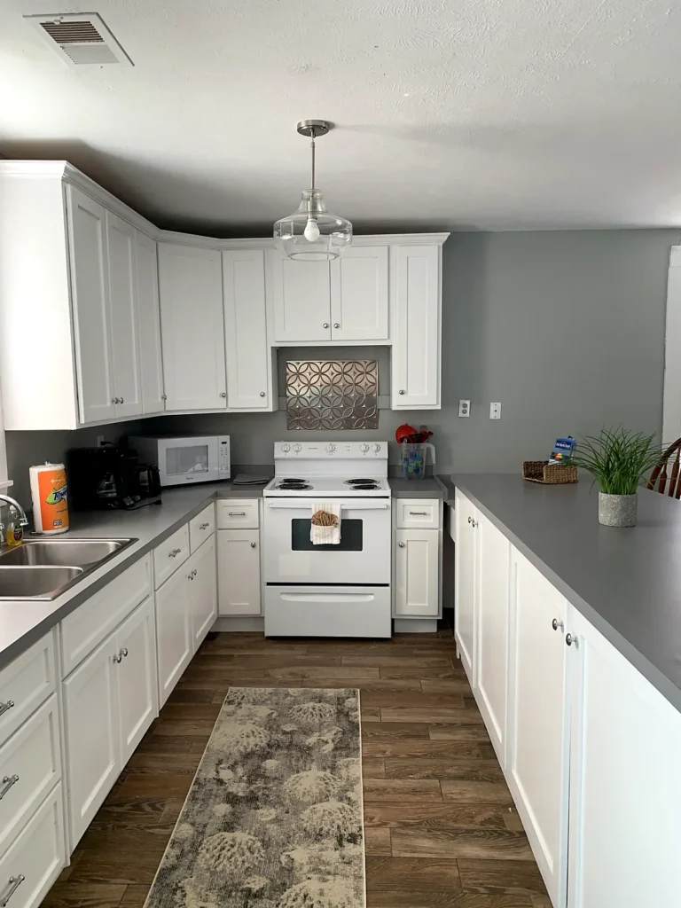 A Beach Place galley kitchen with white cabinets