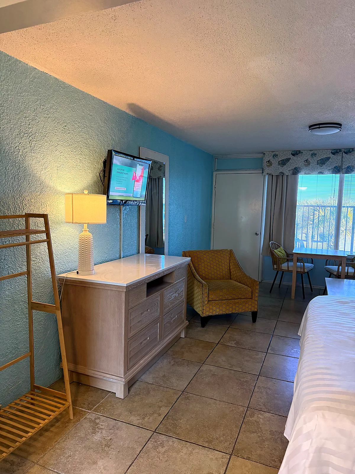 Sitting area with small dining table and dresser
