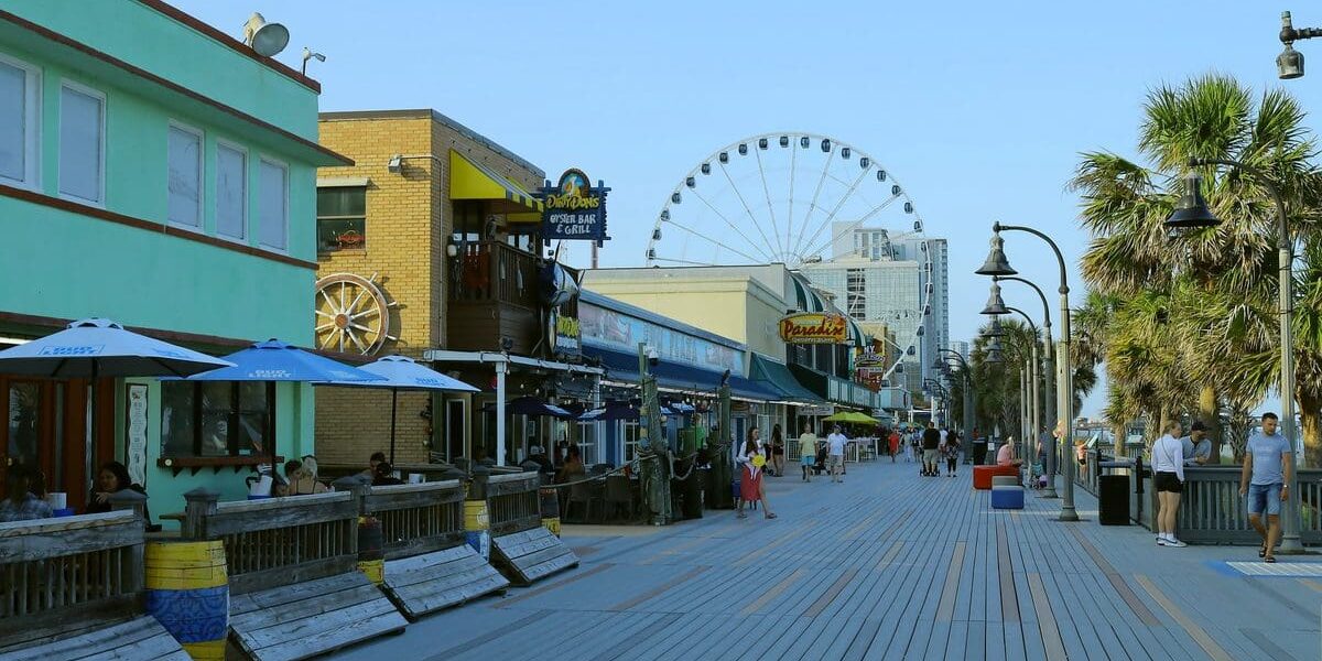 Myrtle Beach Boardwalk with shops and the SkyWheel